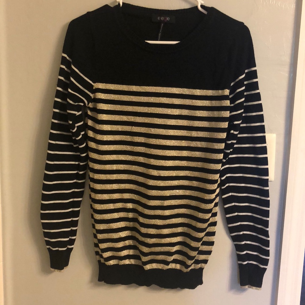 Black, white and gold sweater